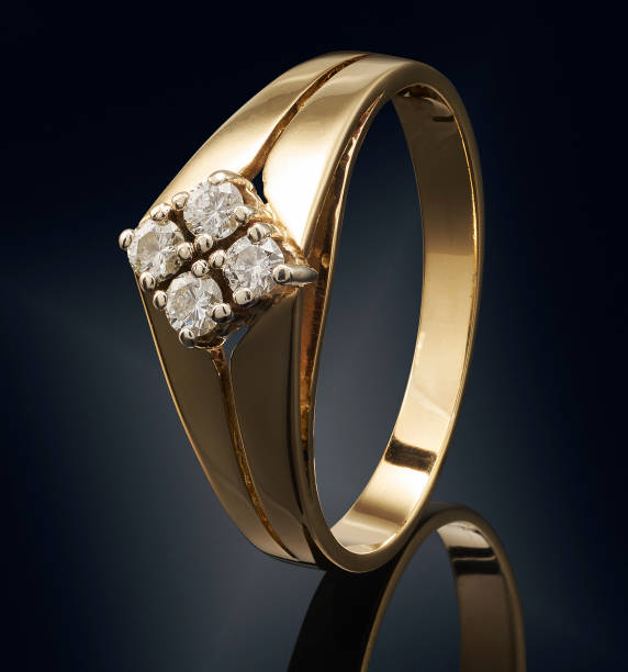 istock Golden ring with gemstone isolated on black background 808705996
