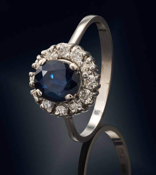 istock Golden ring with gemstone isolated on black background 808706046