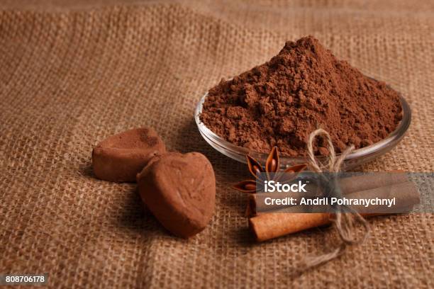 Chocolate Heartshaped Candy On A Rustic Background Chocolate Composition Stock Photo - Download Image Now
