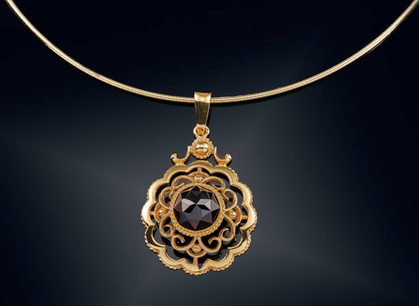 istock Golden necklace with isolated on black 808706242