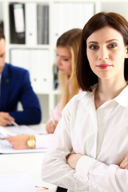 istock Beautiful girl at workplace look in camera 808713408