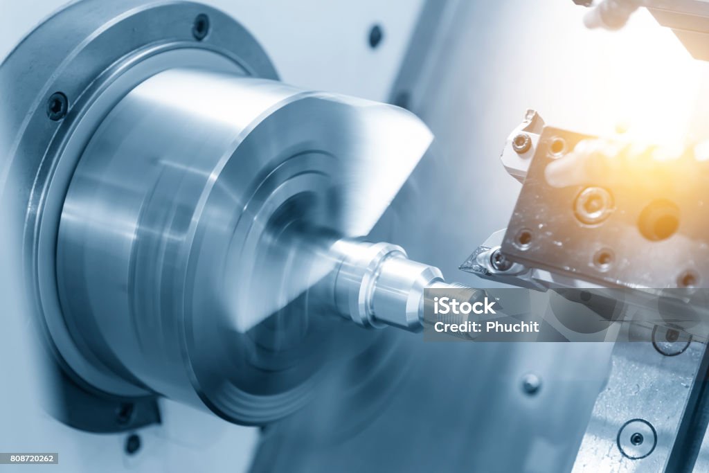 CNC lathe machine (Turning machine) CNC lathe machine (Turning machine) cutting the metal  screw thread part .Hi-precision CNC machining concept. CNC Machine Stock Photo