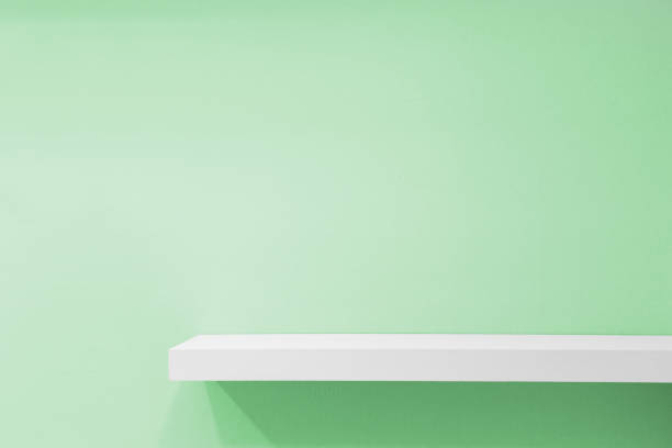 istock Empty white shop shelf, retail shelf on green vintage background. 808732972
