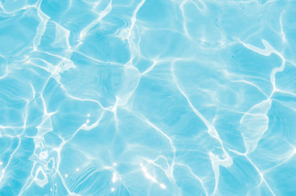 istock Beautiful ripple wave and blue water surface in swimming pool 808760482