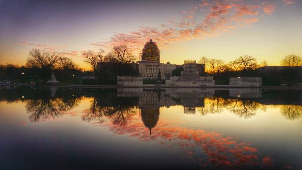 istock Dawn Reflection of US Capitol Building and Reflecting Pool 808769998