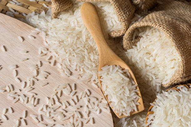 istock Jasmine rice or Basmatic rice on wooden scoop with burlap 808770562