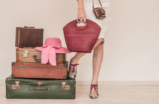 istock Woman Standing Beside Suitcases 808772688