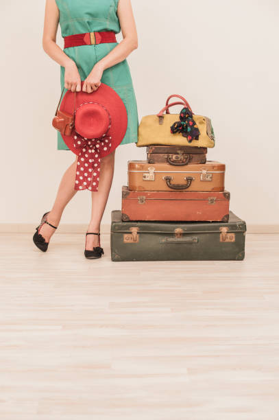 istock Woman Standing Beside Suitcases 808772732