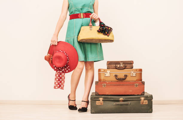 istock Woman Standing Beside Suitcases 808772748
