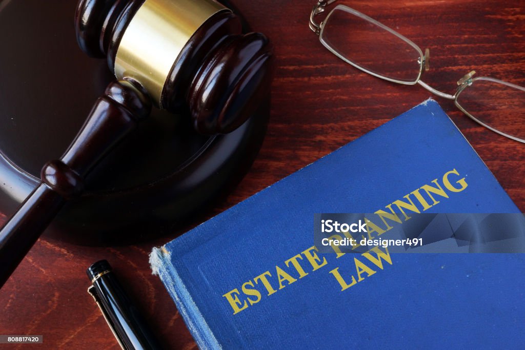 Book with title estate planning law and a gavel. Mansion Stock Photo