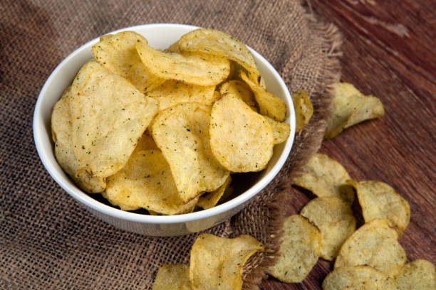 istock still life from a glass bowl with potato chips 808820418