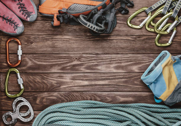 istock Climbing equipment on wooden background. 808825322