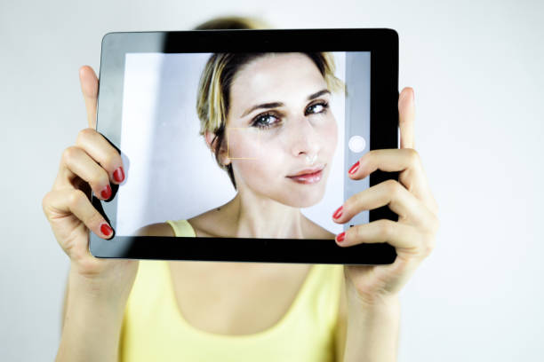 istock Girl taking a self picture with her smart phone or tablet 808826200