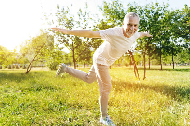istock Cheerful senior man enjoying sport exercises 808827440