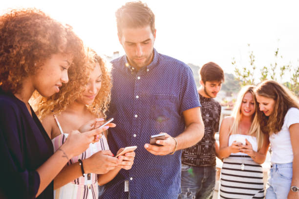 istock Friends enjoying city life using mobile phone 808834308