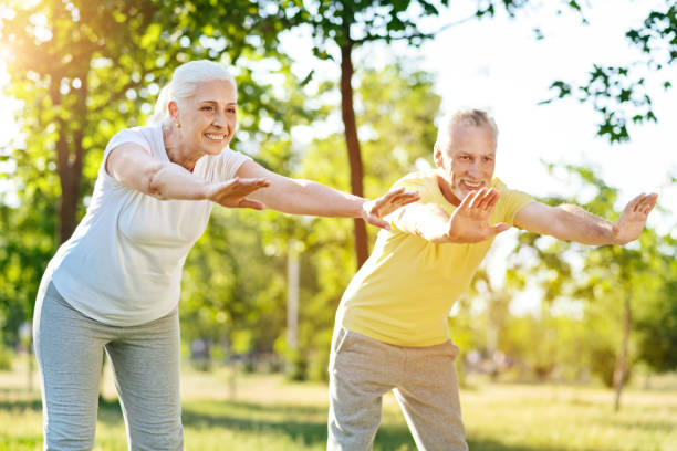 istock Joyful senior couple doing sport exercises together 808835926