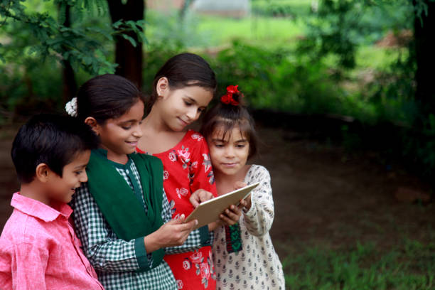 istock Rural children holding digital tablet 808845296