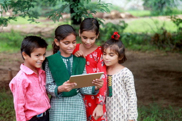 istock Rural children holding digital tablet 808845348