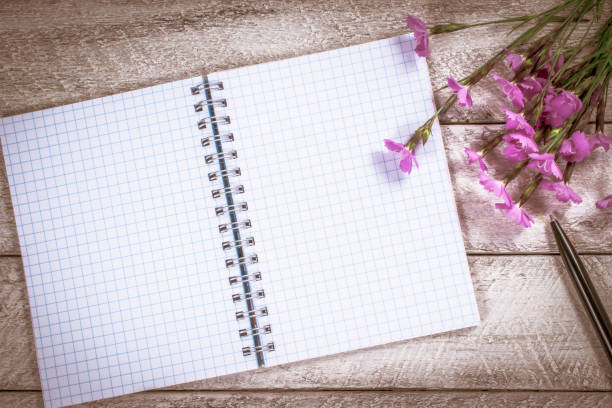 istock flowers on wooden table. copy space. workspace with notebook. celebration template concept. 808847790