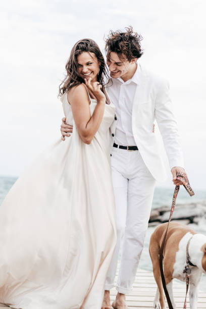 Just engaged couple walking with dog