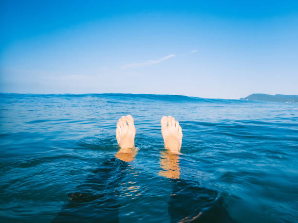 istock Blue wave in ocean and man surfer is relaxed. 808895006