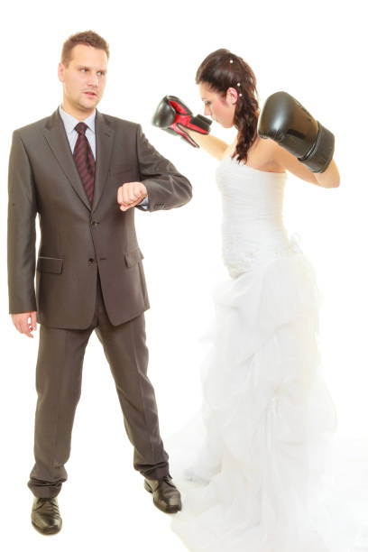 istock Bride boxing her groom on wedding 808937002