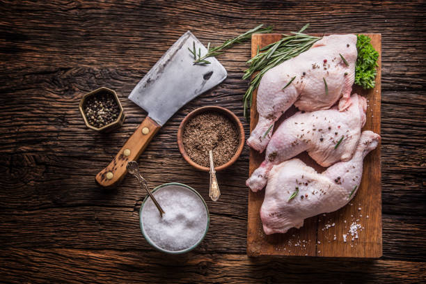 istock Chicken legs. Raw chicken legs with salt pepper and herbs 808939402