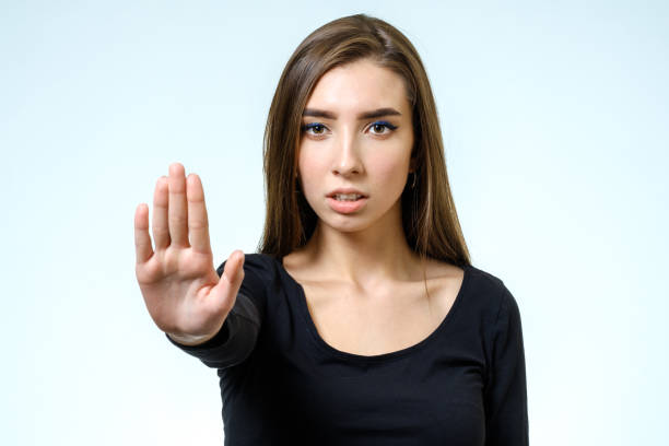 istock Young woman making rejection pose on white background 808982376