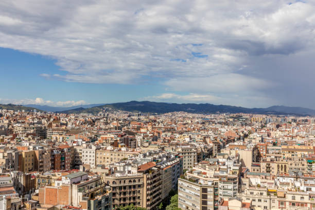 istock Barcelona skyline with dark clouds coming 809012618