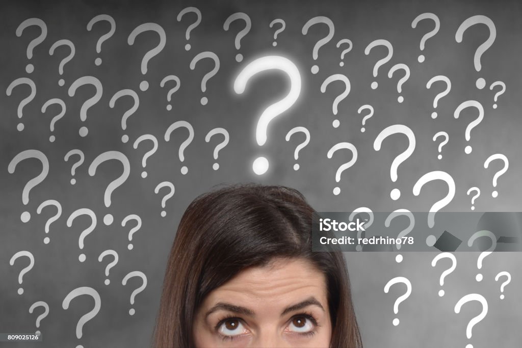 young woman with a question mark on her head young woman with a question mark on her head, future anxiety concept Adult Stock Photo