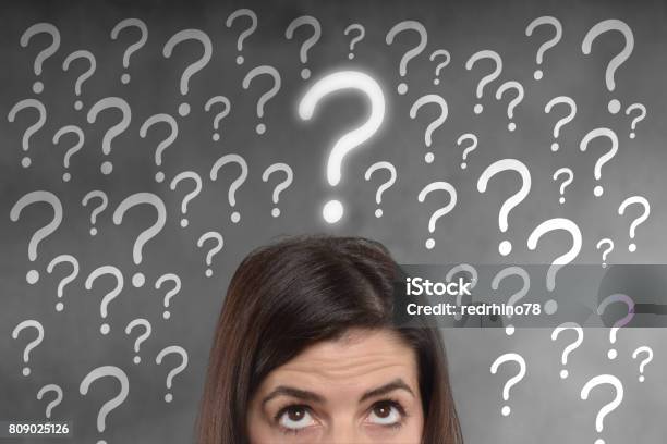 Young Woman With A Question Mark On Her Head Stock Photo - Download Image Now - Adult, Anxiety, Asking