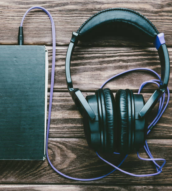 istock Headphones with a paper book. 809030452