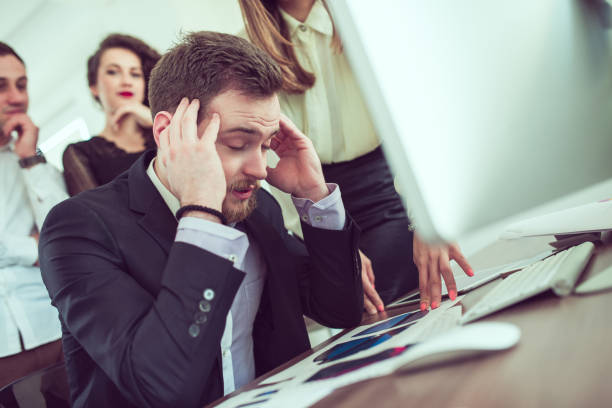 istock Stressful Businessman with Headache when Receiving Many Complaints 809056242
