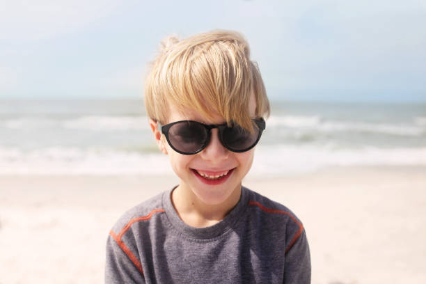 istock Happy Smiling Child on Beach by Ocean 809056552