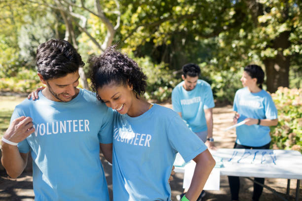 istock Smiling volunteers talking to each other 809071530