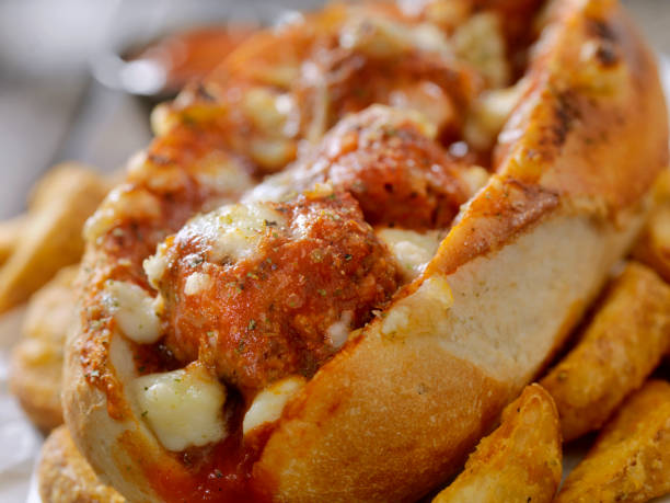 Meatball Sub with Thick Cut Fries Toasted Meatball sub with Marinara Sauce and Fresh Mozzarella Cheese submarine photos stock pictures, royalty-free photos & images
