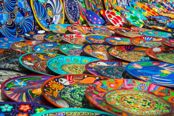 istock Souvenirs on the market at Chichen Itza. Maya Indians, skull, magnets, plates 809081012