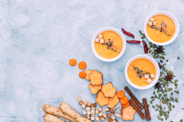 istock Homemade fresh carrot pumpkin soup in white bowl 809086590