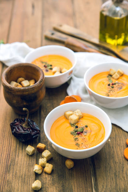 istock Homemade fresh carrot pumpkin soup in white bowl 809091452