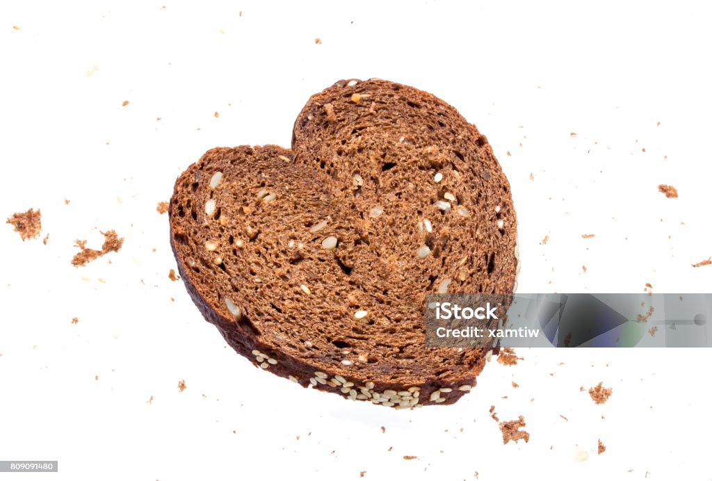 Heart made from bread on white background Baked Stock Photo