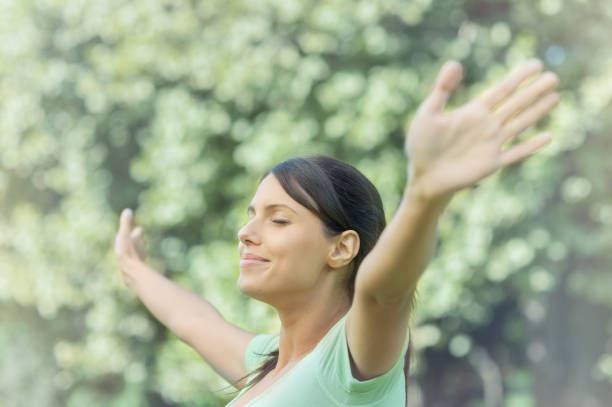 istock Beautiful young woman in the park 809097726