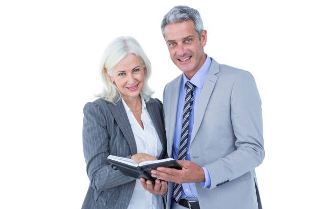 istock Smiling businesswoman and man with a notebook 809100876