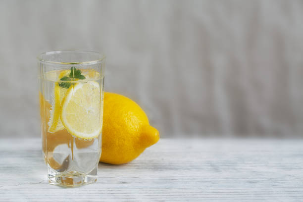 istock Lemonade with fresh lemon on wooden background 809106030