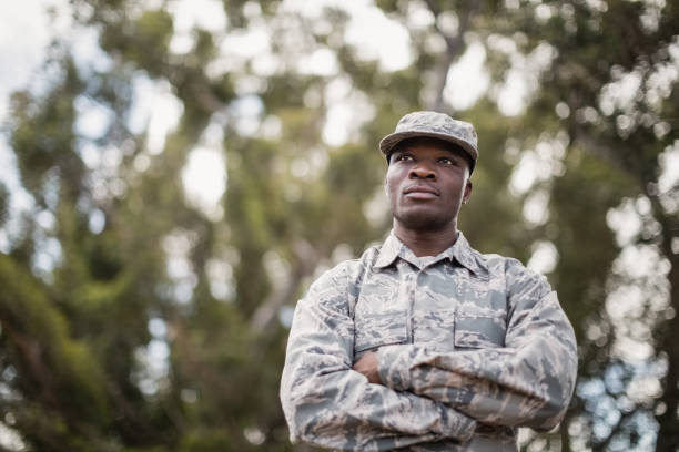 istock Thoughtful military soldier standing with arms crossed 809138826