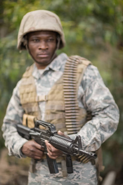 istock Military soldier guarding with a rifle 809169490
