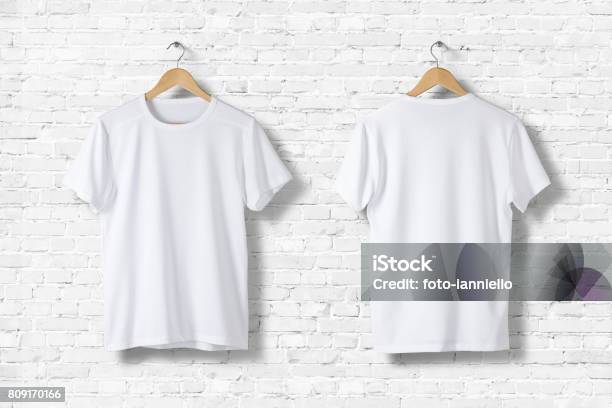 Blank White Tshirts Mockup Hanging On White Wall Front And Rear Side View Ready To Replace Your Design Stock Photo - Download Image Now