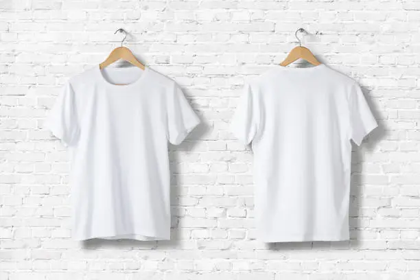 Photo of Blank White T-Shirts Mock-up hanging on white wall, front and rear side view . Ready to replace your design