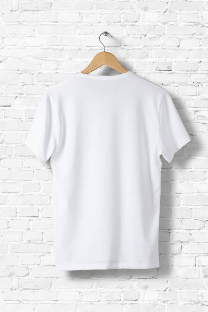 istock Blank White T-Shirt Mock-up hanging on white wall, rear side view . Ready to replace your design 809170912