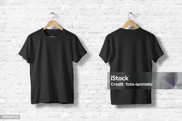Blank Black Tshirts Mockup Hanging On White Wall Front And Rear Side View Ready To Replace Your Design Stock Photo - Download Image Now