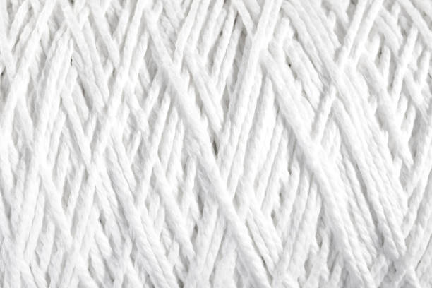 istock Roll of white rope isolated on white background 809227990